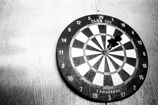 A dartboard with three bullseyes